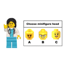 A female doctor figurine with a stethoscope.