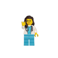 A female doctor figurine with a stethoscope on a white background.
