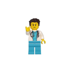 A male doctor figurine with a stethoscope.