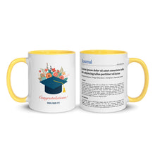Two mugs with yellow handles, one featuring a graduation cap and flowers, the other with text.